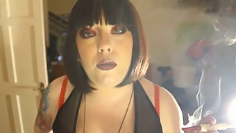 Tina Smua, A Fat Domme, Smokes A Filterless Cigarette In A Holder