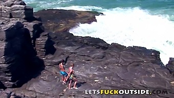 Outdoor Adventure: Women Engage In Sexual Activity On A Rock And Risk Getting Discovered